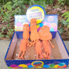 A box of Crystal Pinch Music squishy balls featuring orange fidget toys for adults and kids.