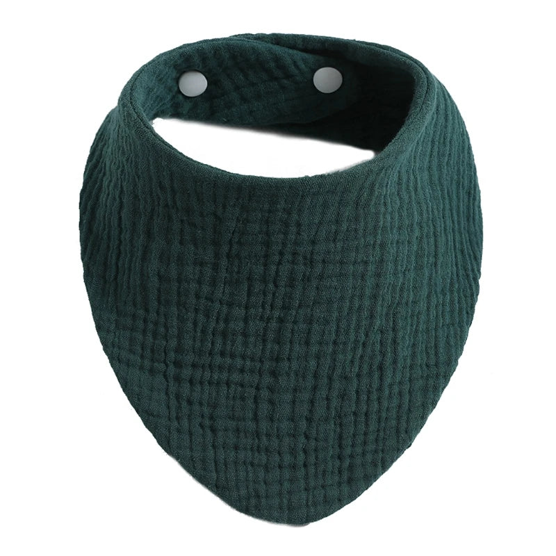 Dark green organic cotton muslin baby bib with an absorbent band