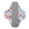 Reusable cotton menstrual pads featuring a gray absorbent pad and colorful floral designs.