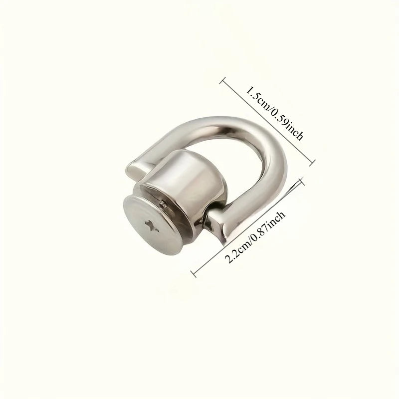 Silver metal hardware kit for a bag and phone case, including screws.