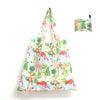 A reusable shopping tote bag featuring a tropical floral print with pink, green, and orange elements.