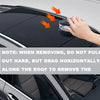 A hand is removing a magnetic mount LED emergency strobe light from the roof of a car.