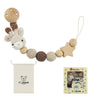 Wooden pacifier clip with crochet beads on a chain, packaged for a baby