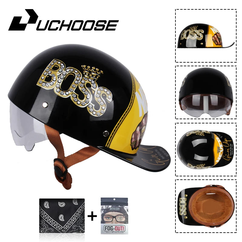 Black motorcycle helmet with gold Boss logo and a yellow visor, shown next to its packaging.