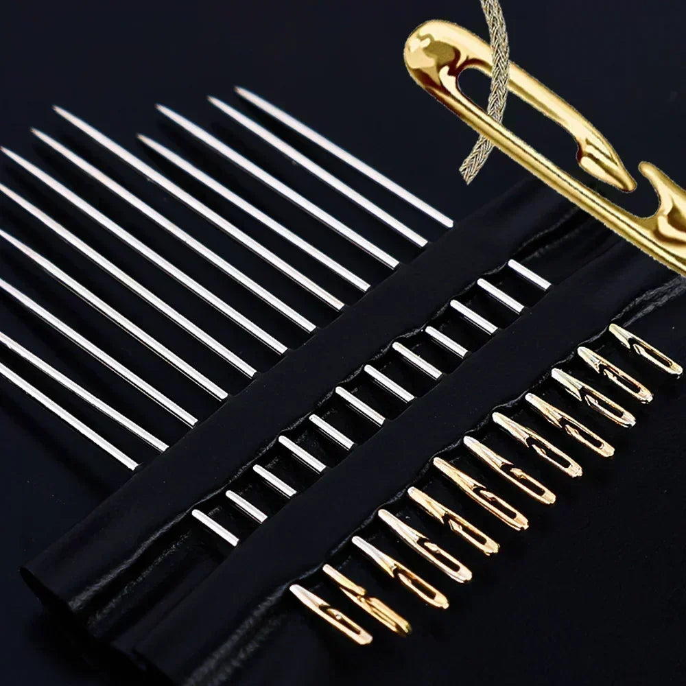 A close-up of stainless steel self-threading sewing needles and a gold-colored tool on a black background.