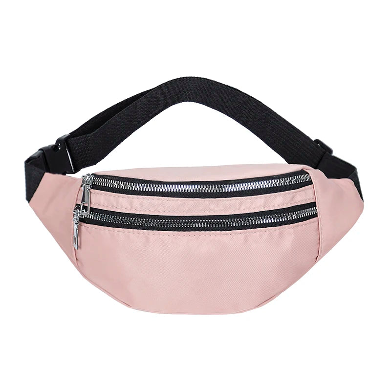 A pink nylon waist pack with a black adjustable strap and a zippered pocket.