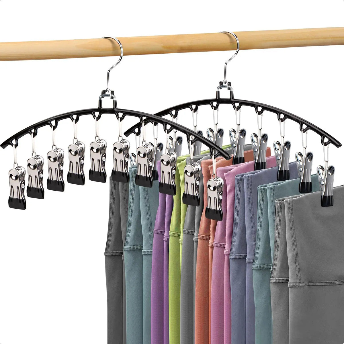 Stainless steel space-saving hanger with ten clips displaying various colored shirts.