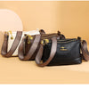 A collection of brown and black PU leather crossbody shoulder bags with patterned straps displayed on a light background.