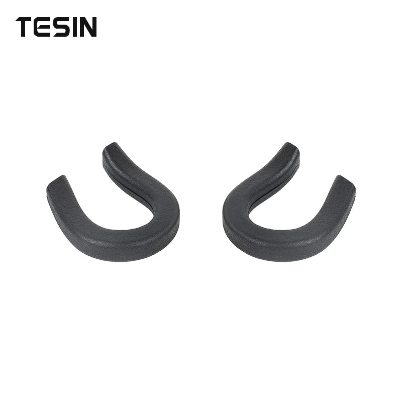 A pair of black front bumper tow hook covers for Chevrolet Silverado and GMC Sierra trucks.