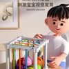 A white cube sorter filled with colorful fruit shapes secured by soft elastic bands, shown next to a child.