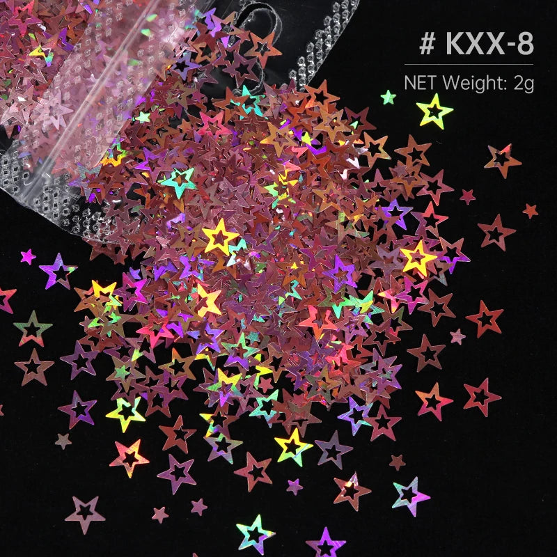 A close-up view of a pile of multi-colored holographic star sequins for resin crafts, with some loose pieces scattered on a d
