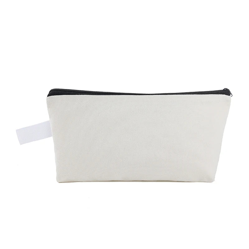 A rectangular, light beige canvas zipper pouch with a black trim.