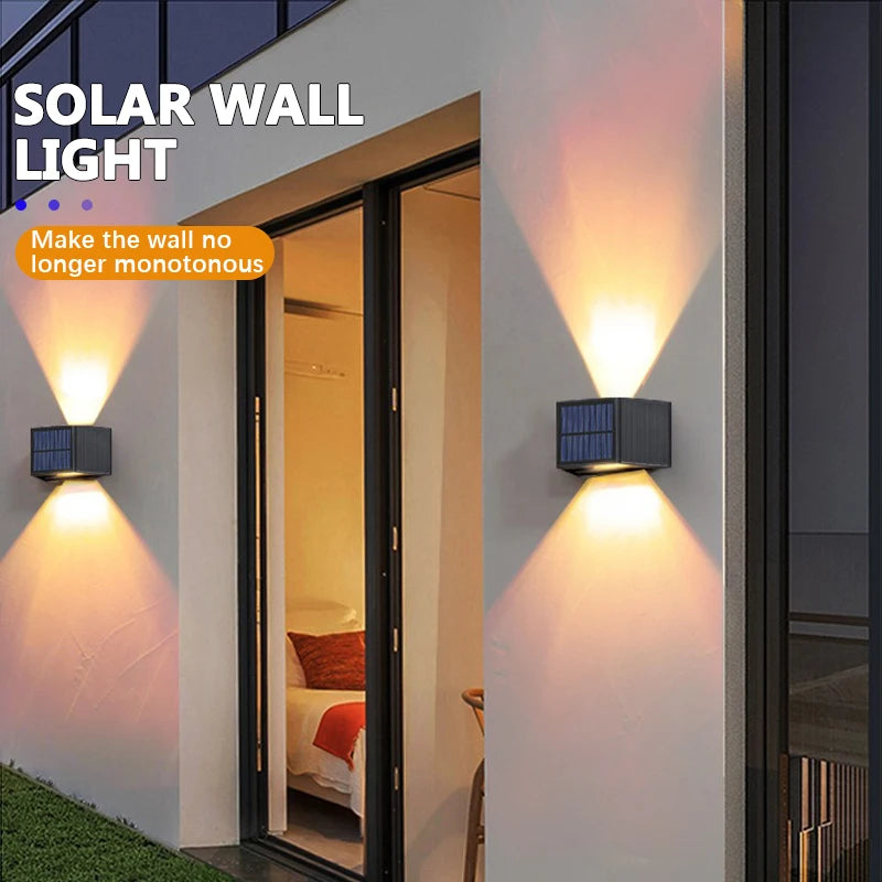 Solar wall light illuminating a doorway with a warm glow on a modern exterior wall.