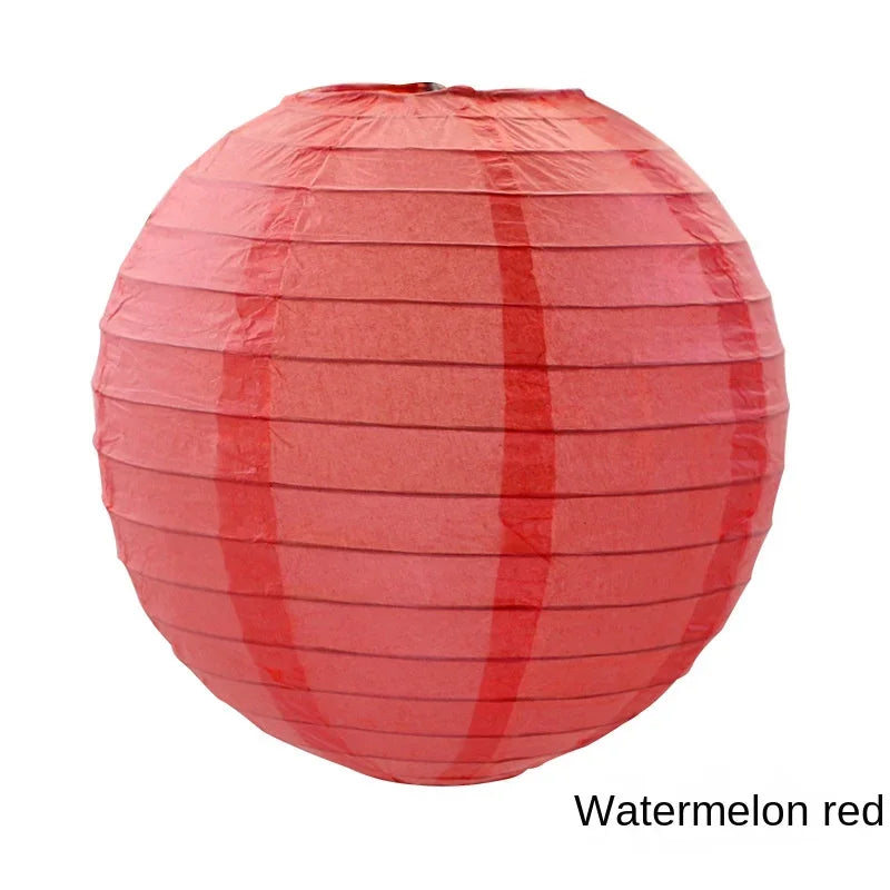 A round red paper lantern with horizontal folds.