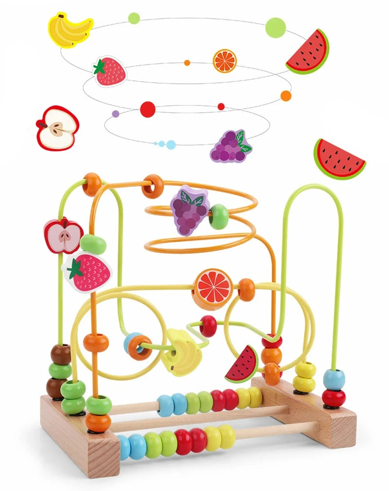 A wooden bead maze toy showing various fruits and vegetables arranged on a wooden track.