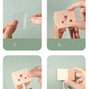 Installation steps showing how to attach an adhesive hook to a surface.