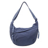 A navy blue lightweight nylon crossbody bag with adjustable straps.