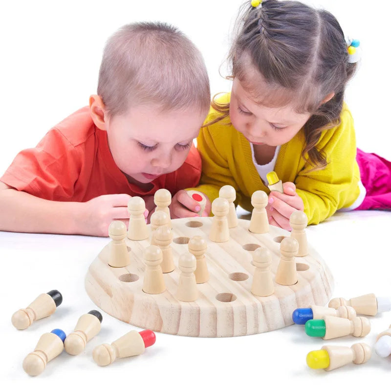 Two children are playing with a wooden memory chess game featuring colored pieces.