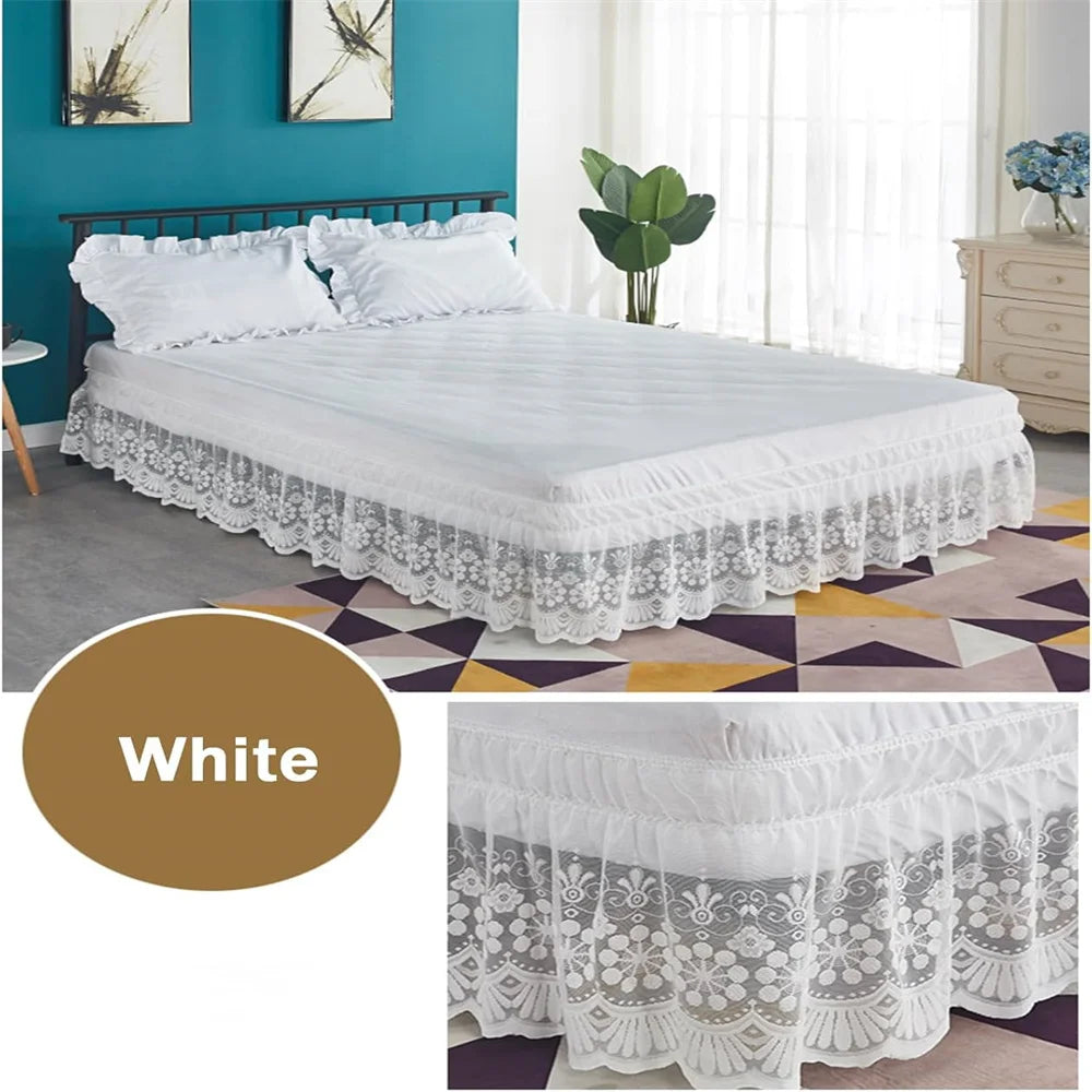 White ruffled lace bed skirt with elastic fit displayed on a bed in a modern bedroom.