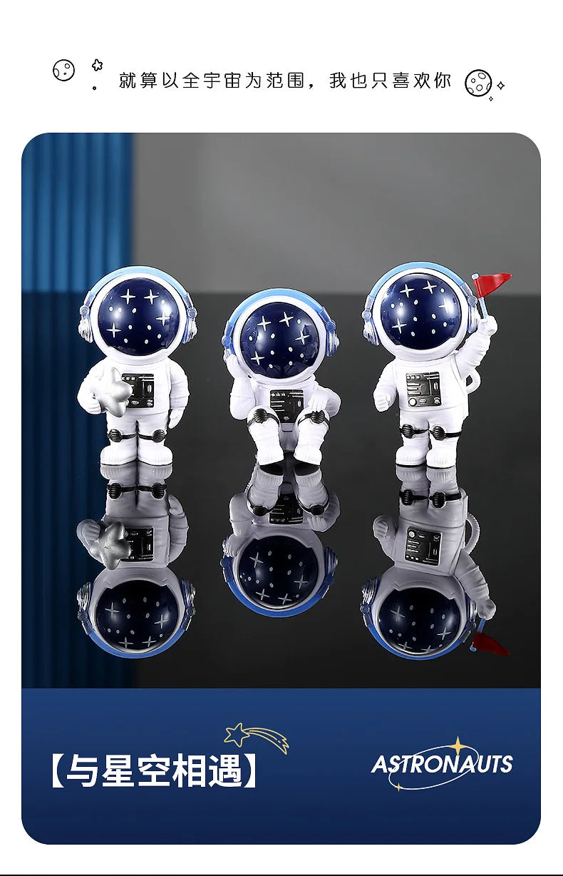 Three handcrafted astronaut figurines in white and blue resin depicting space exploration