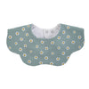 A light sage green muslin cotton baby bib with a white daisy pattern and an adjustable snap closure.