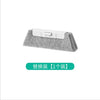 A gray multi-surface gap cleaning brush with a white plastic handle and scouring pad.