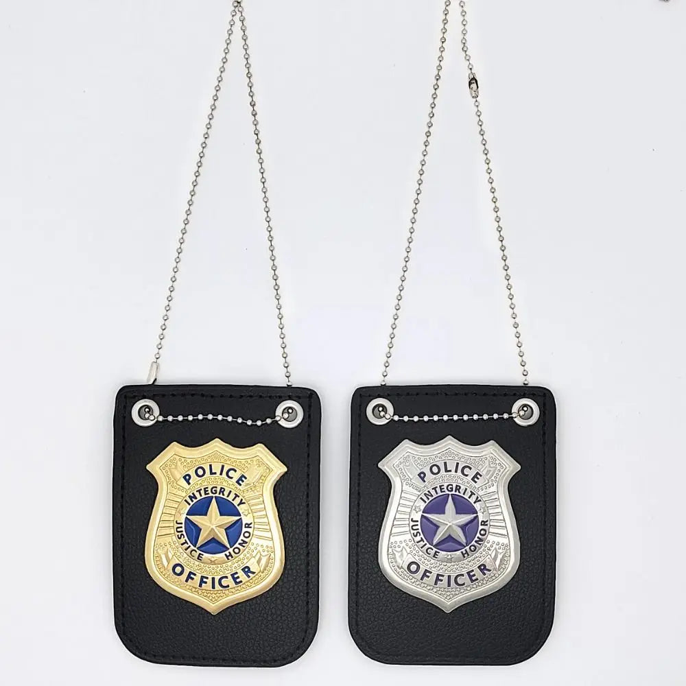 A black police badge role-play accessory with a gold emblem and silver chain hanging from it.