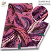 Pink glitter African wax print fabric in a floral pattern shown as a rolled textile swatch