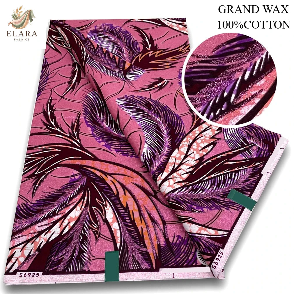 Pink glitter African wax print fabric in a floral pattern shown as a rolled textile swatch