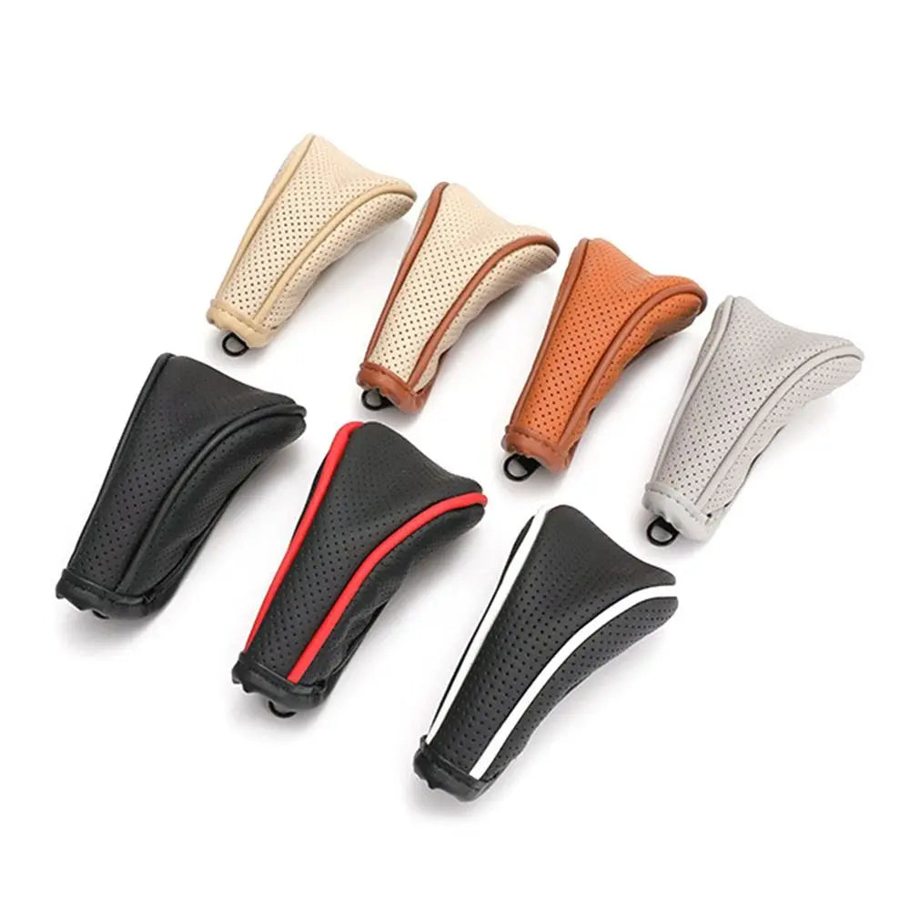 A collection of leather gear shift knob covers in various shades including beige, brown, gray, and black.