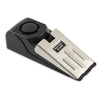 A black high-decibel wireless door stop alarm with a silver plate and a round button.