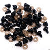 A collection of black safety noses with clear washers for stuffed animals and DIY crafts