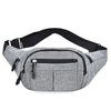 Gray canvas waist pack with black adjustable strap and multiple zippered pockets