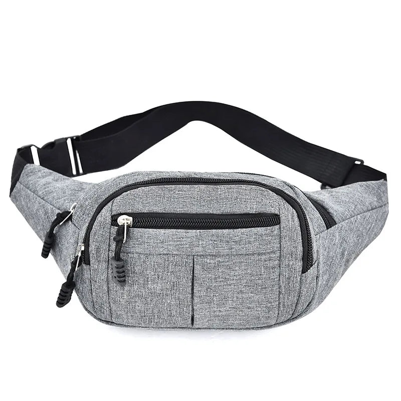 Gray canvas waist pack with black adjustable strap and multiple zippered pockets
