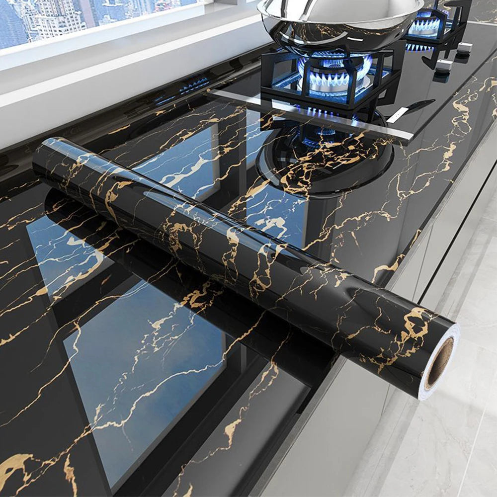 Black marble peel-and-stick film used as a kitchen backsplash, displayed on a countertop.