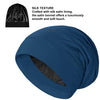 A deep blue silk satin sleep bonnet shown in a draped style.