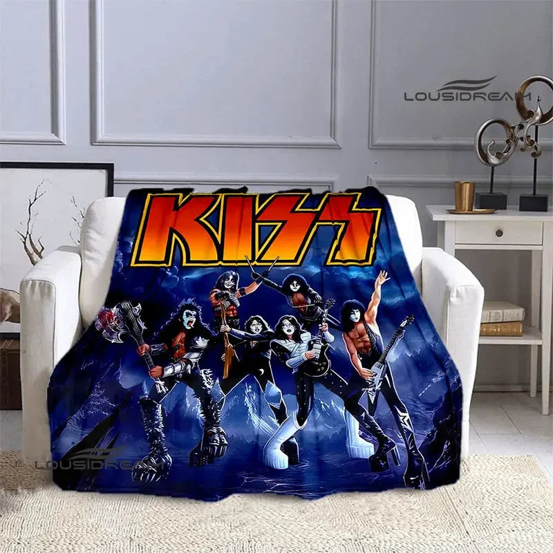 A dark blue flannel throw blanket featuring a graphic print of the Kiss band members.