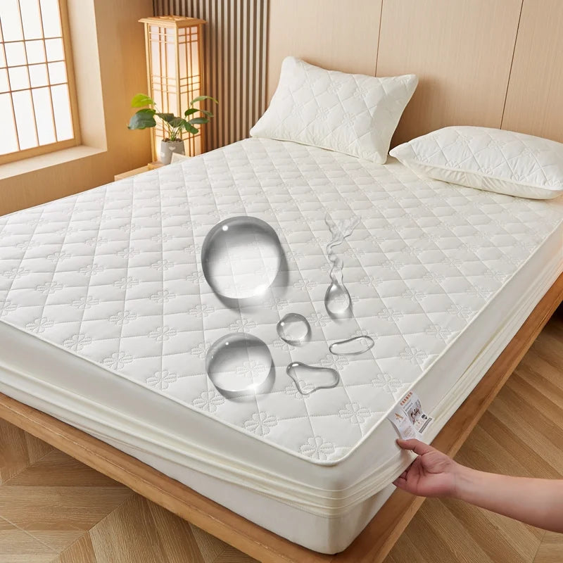 A white durable waterproof mattress protector is shown on a wooden bed frame.