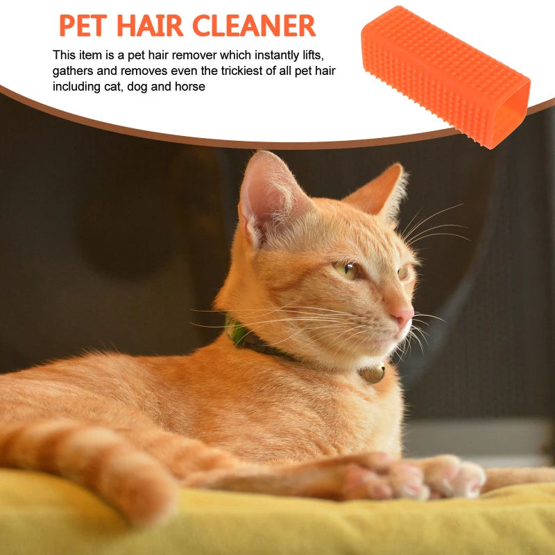 An orange tabby cat is looking at a silicone pet hair remover brush.