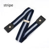 A black and white striped stretch elastic belt with a silver buckle.