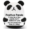 A white and black panda plush ornament with a supportive message on the tag.