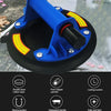 Blue vacuum suction cup lifter with a black cylinder and mounting plate for heavy-duty lifting.