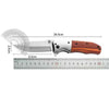 A folding pocket knife featuring a stainless steel blade and a walnut wood handle, shown with a measurement scale.