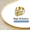 A close-up of a gold-toned ring with diamond accents displayed on a white background.
