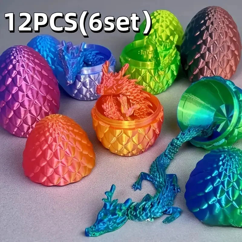 A collection of twelve colorful 3D printed dragon and egg sculptures in various shades of pink, green, blue, and orange.