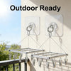 Outdoor ready stainless steel wall hooks with hangers mounted on a light-colored wall.