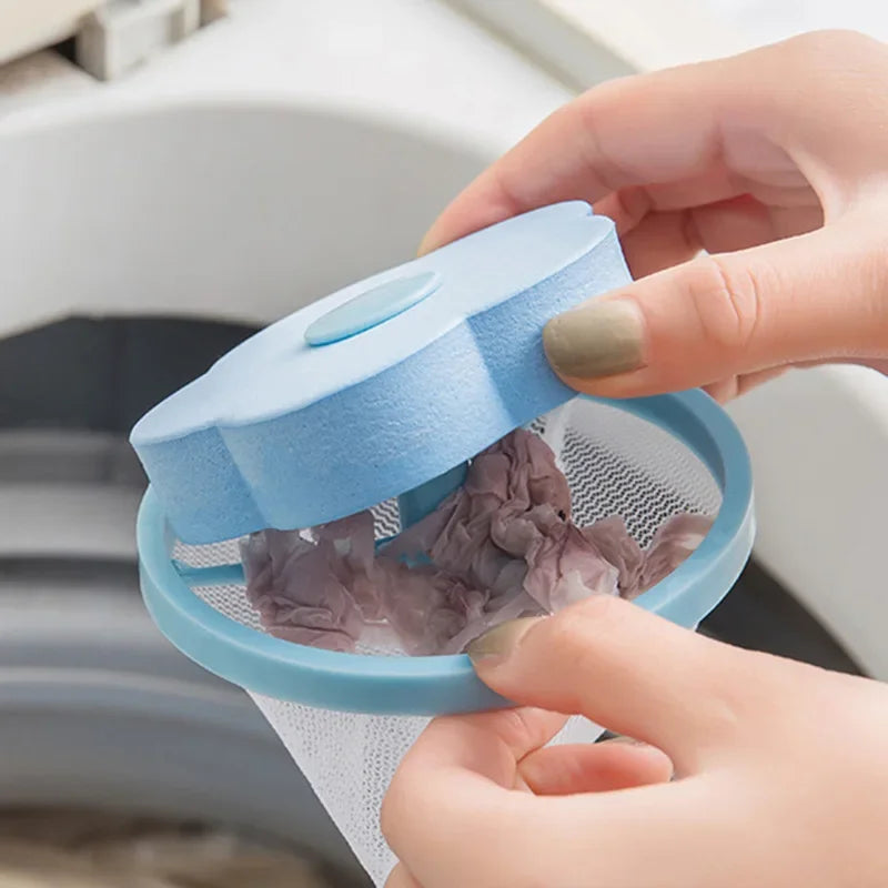 A hand is opening a blue filter bag for a washing machine lint and hair catcher filter.