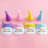 A set of pet birthday party hats and bibs for cats and small dogs in purple, pink, yellow, and blue.
