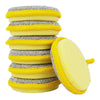 A stack of yellow and silver microfiber cleaning cloths for dishes.