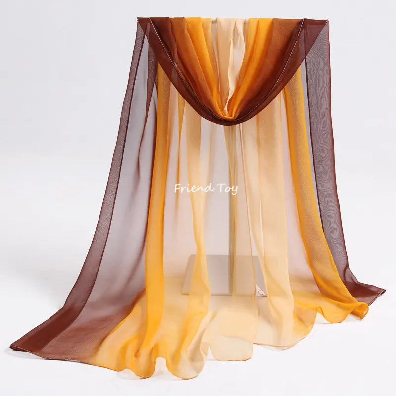 Montessori playsilk fabric in shades of orange and brown draped over a stand
